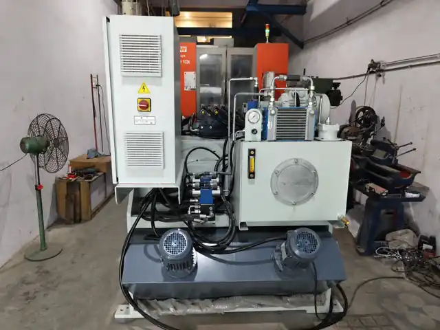 Powerbits brass GDC hydraulic power unit and control cabinet inside the factory
