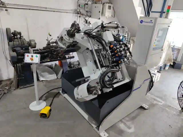 Powerbits brass gravity die casting machine and control panel inside the Powerbits factory